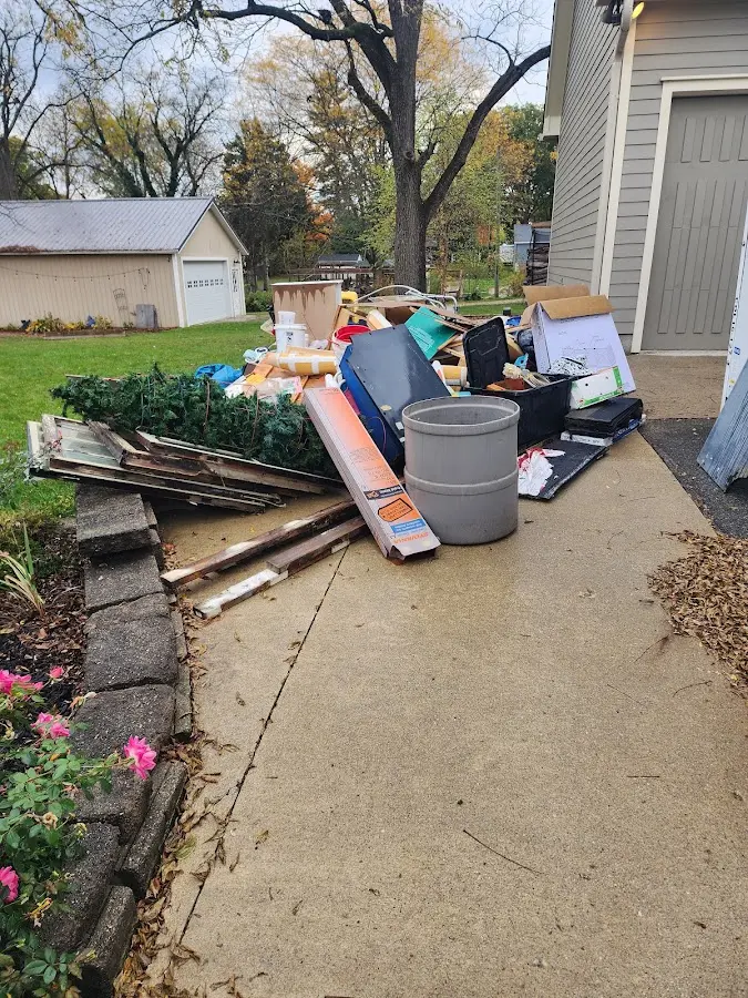 Dumpster being loaded with debris for Residential Dumpster Rental in Cloverdale